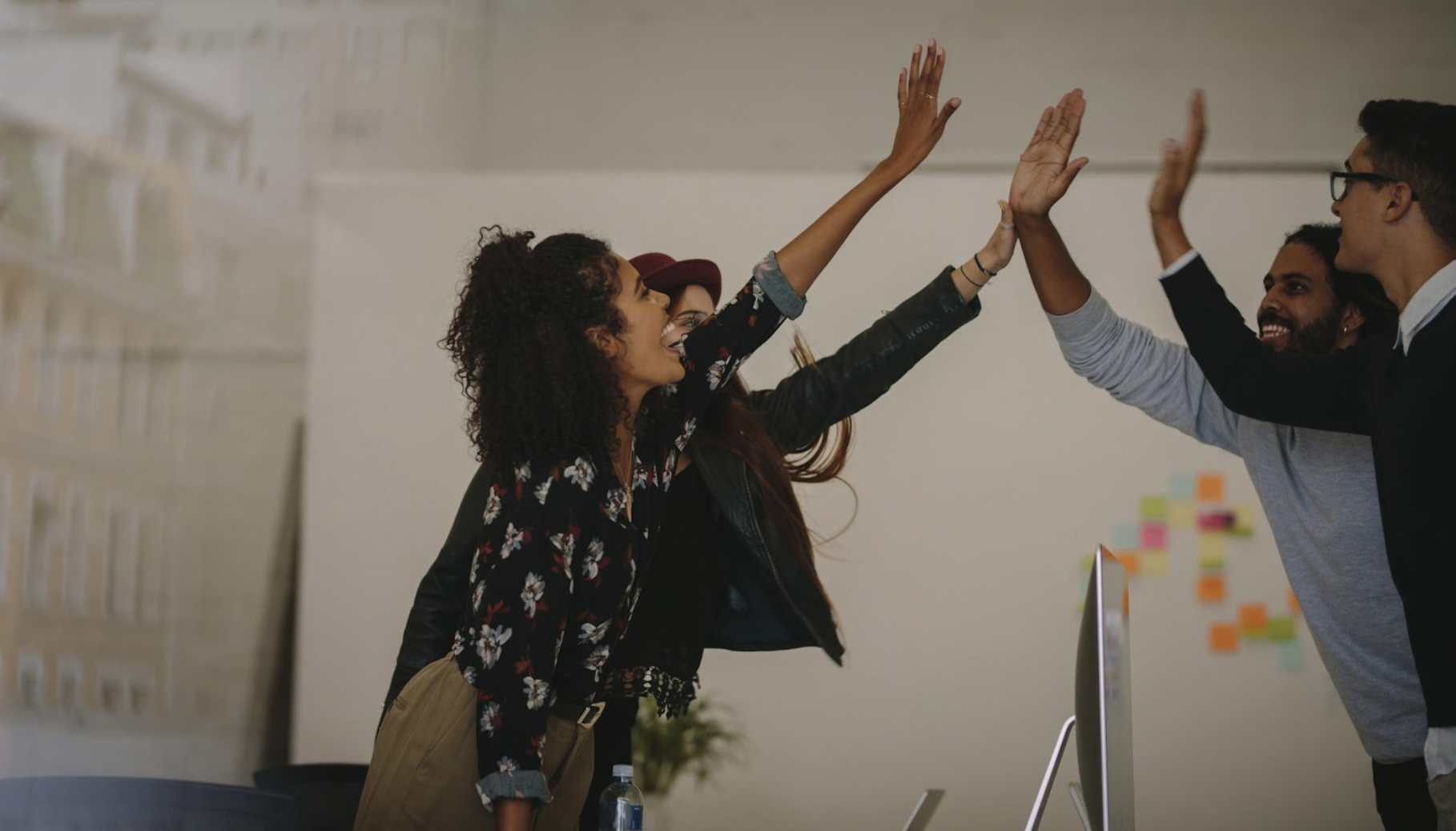 Team celebrating with a high five